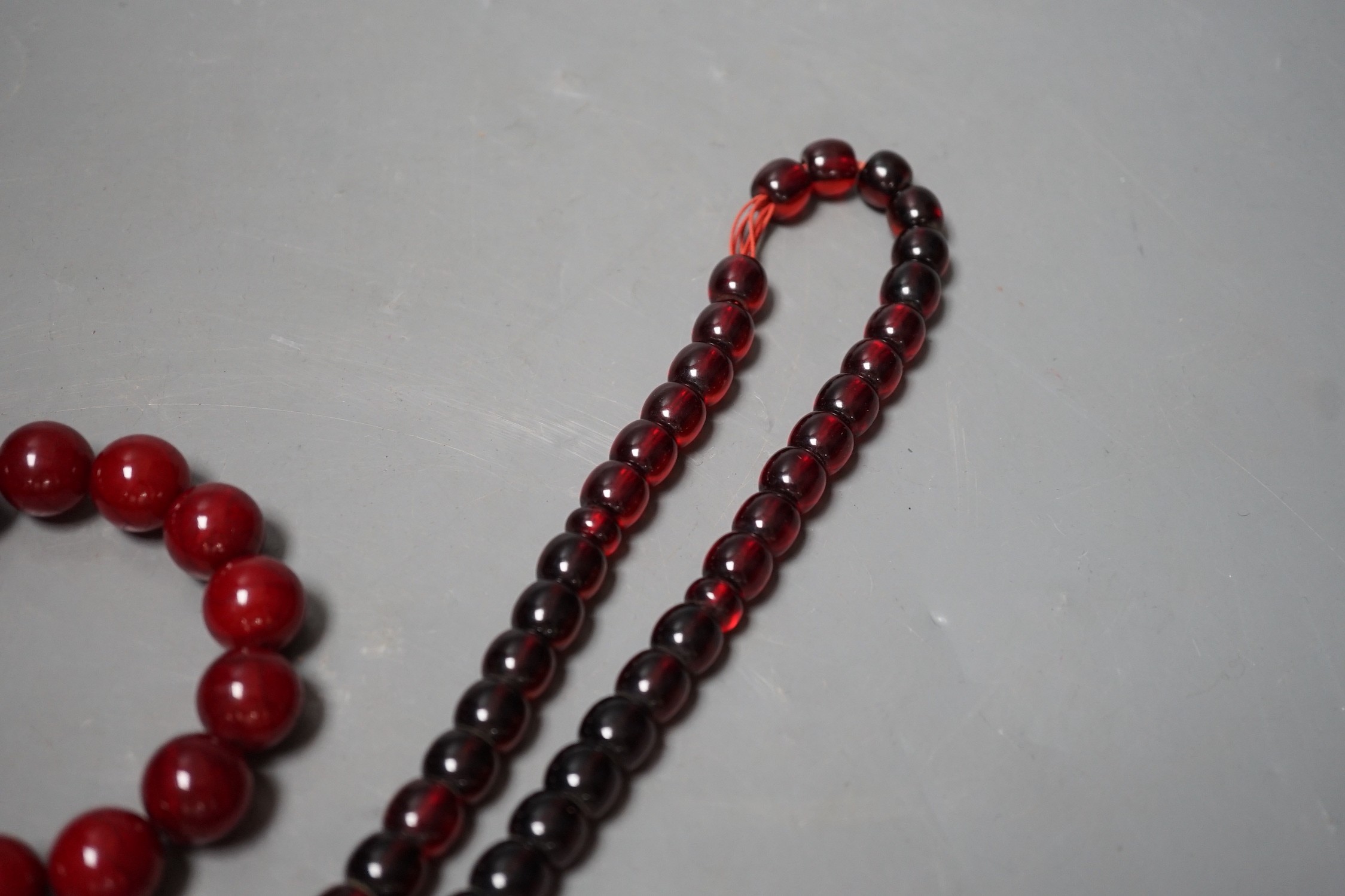 Two simulated Cherry Amber beads